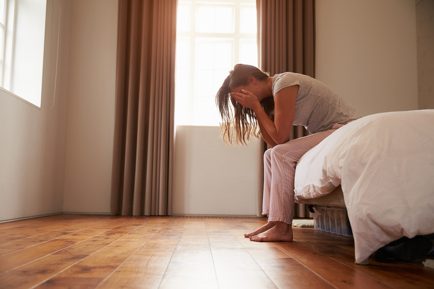 woman on side of bed